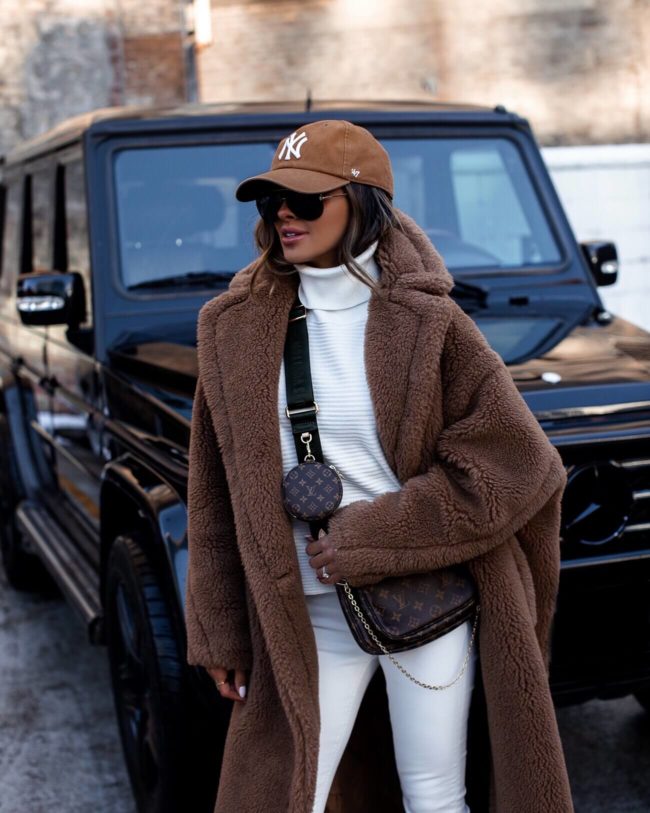 fashion blogger mia mia mine wearing a max mara teddy bear coat and a louis vuitton multi pochette accessories bag