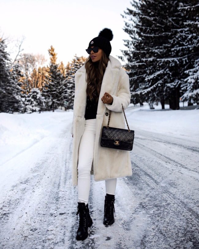 fashion blogger mia mia mine wearing a white faux fur coat