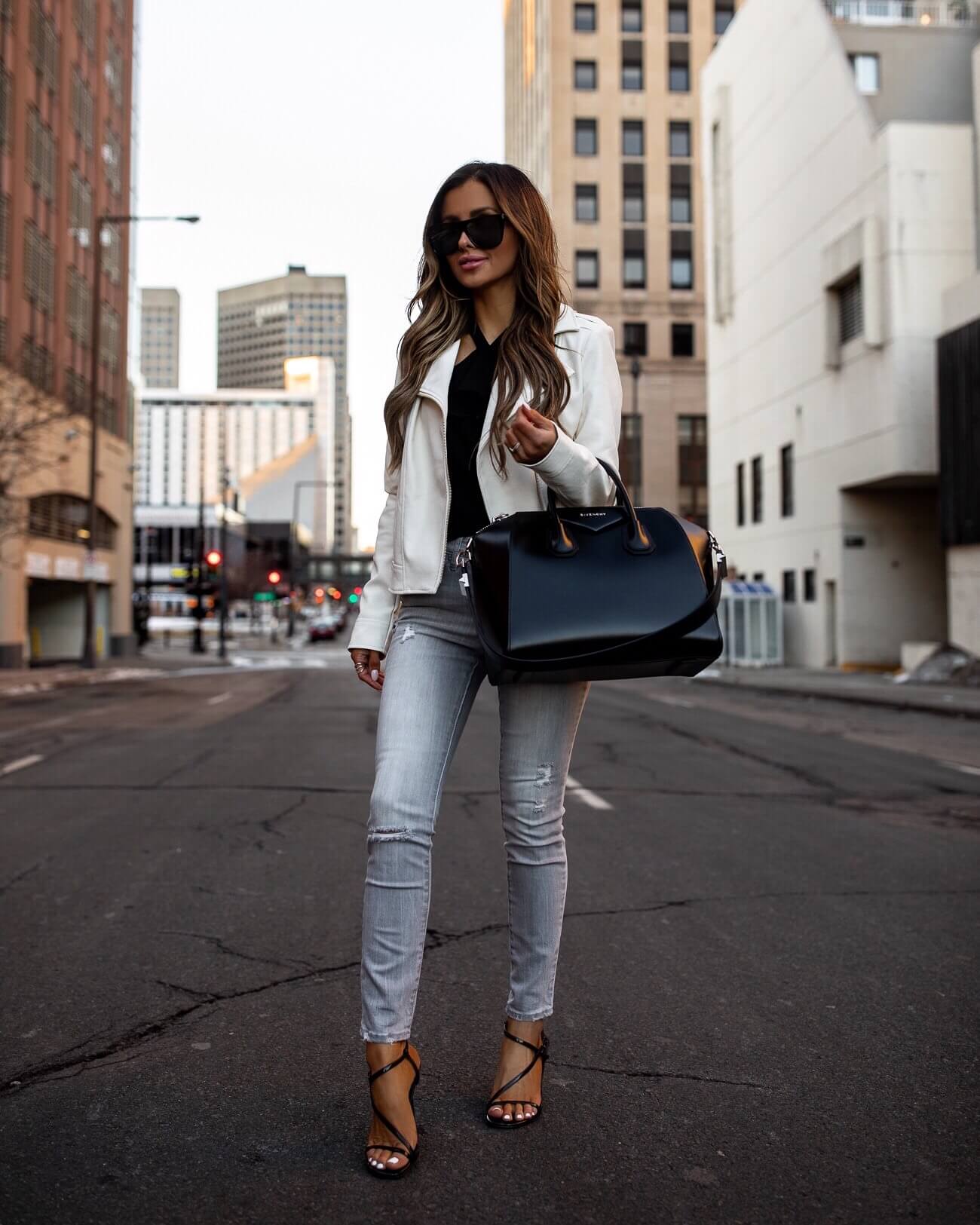fashion blogger mia mia mine wearing a white faux leather jacket for spring