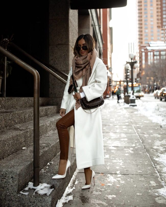 fashion blogger mia mia mine wearing a white coat from mango for winter