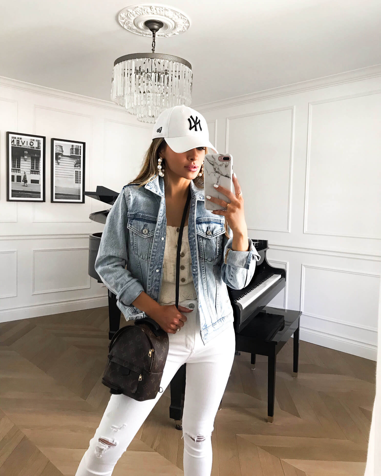 fashion blogger mia mia mine wearing a denim jacket and white distressed denim from abercrombie