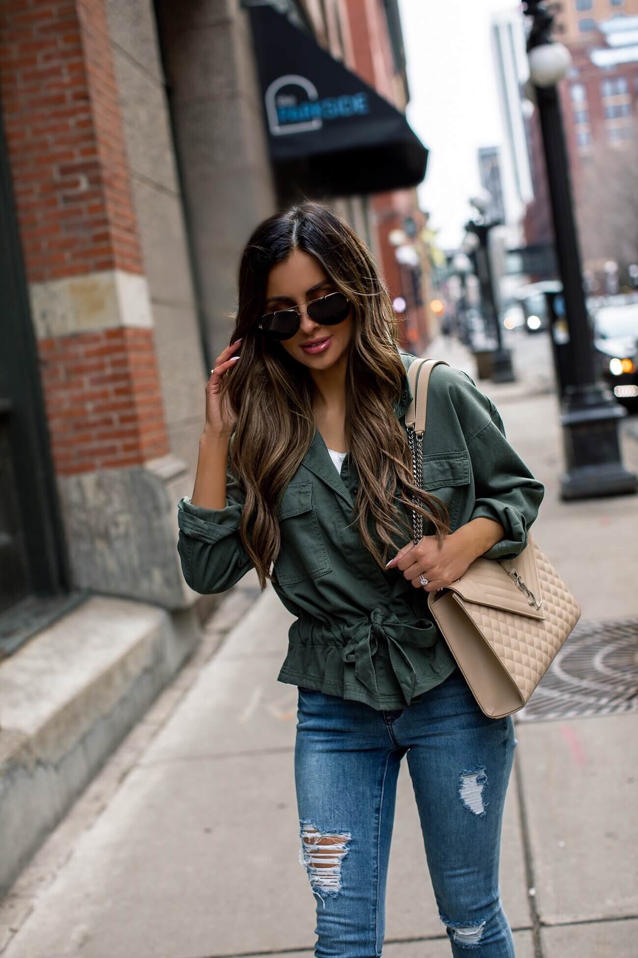 fashion blogger mia mia mine wearing a scoop utility jacket and sofia jeans from walmart