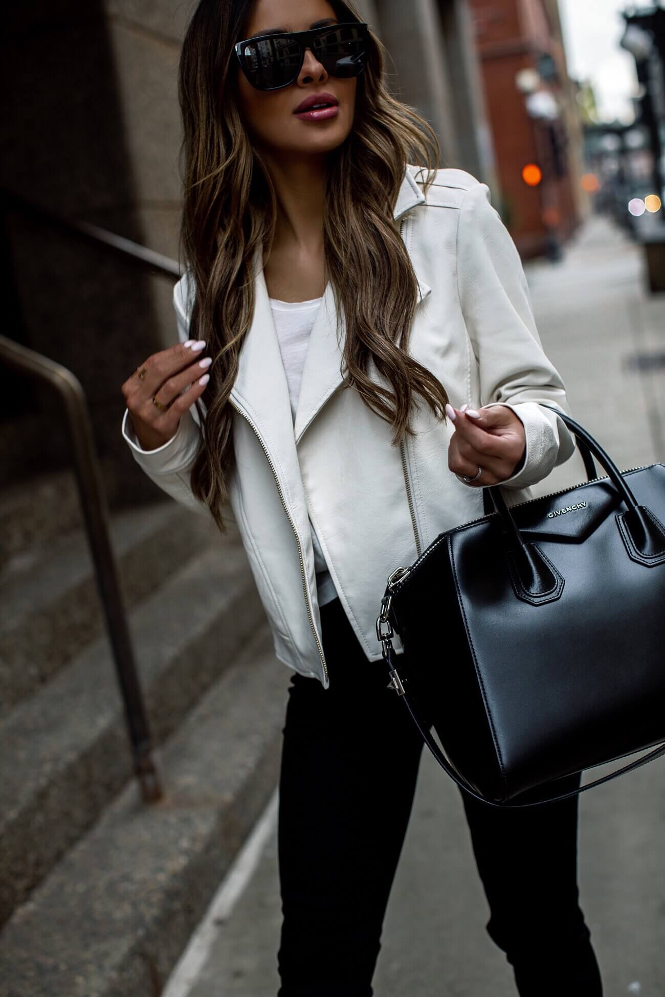 fashion blogger mia mia mine wearing a white faux leather moto jacket from walmart