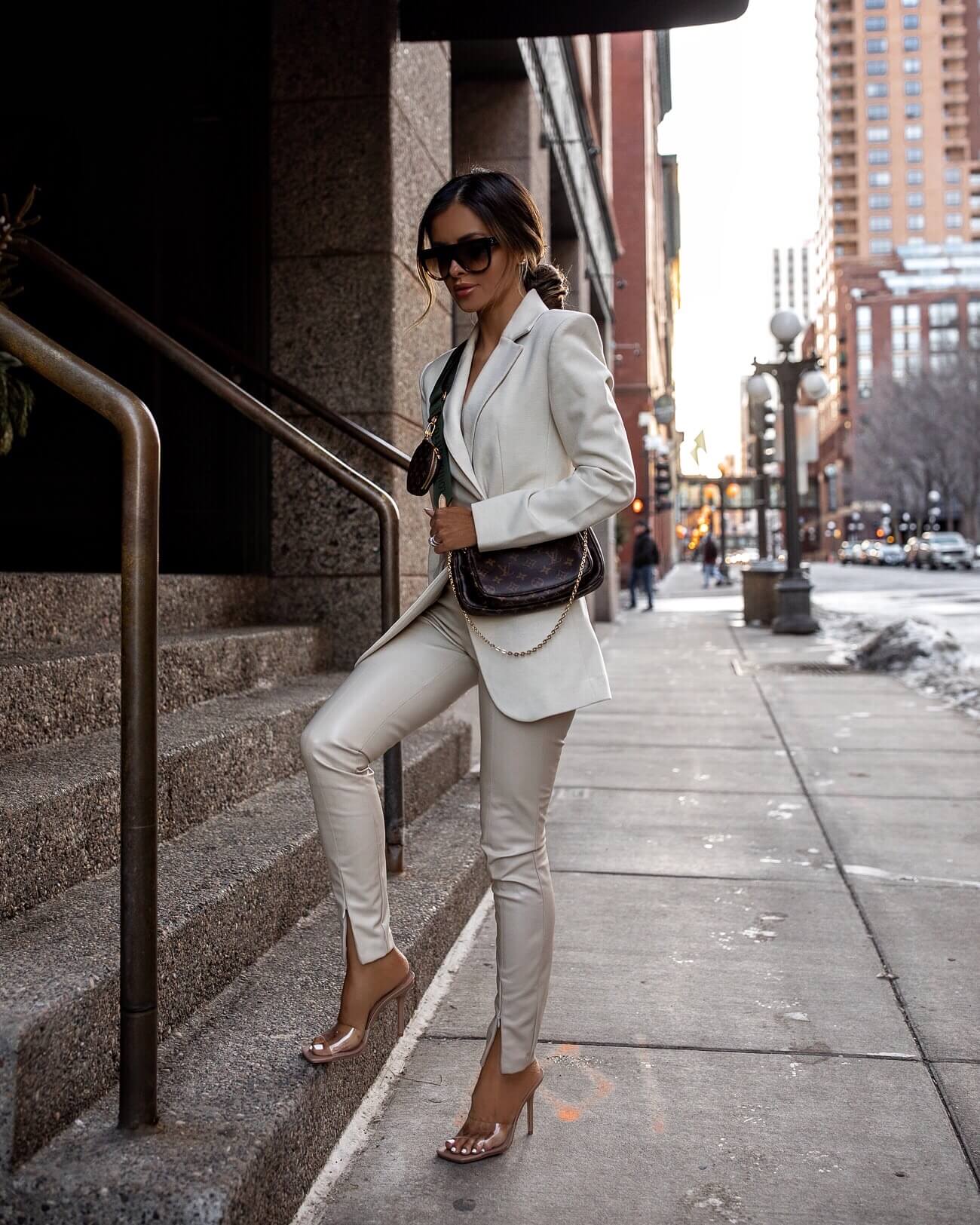 fashion blogger mia mia mine wearing a white blazer and faux leather pants from & other stories