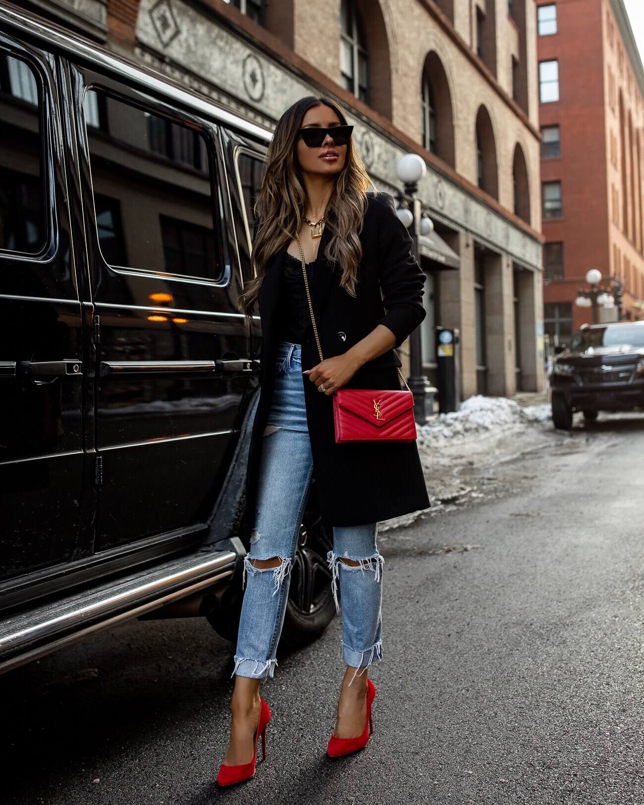 fashion blogger mia mia mine wearing red christian louboutin heels and a red saint laurent bag