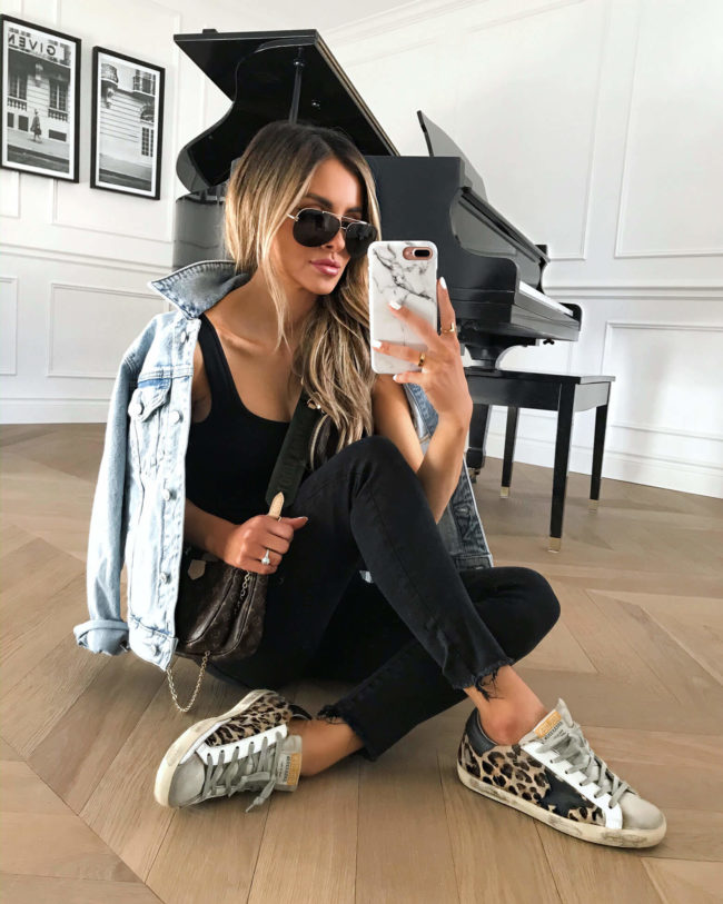 fashion blogger mia mia mine wearing a black bodysuit and black denim from abercrombie