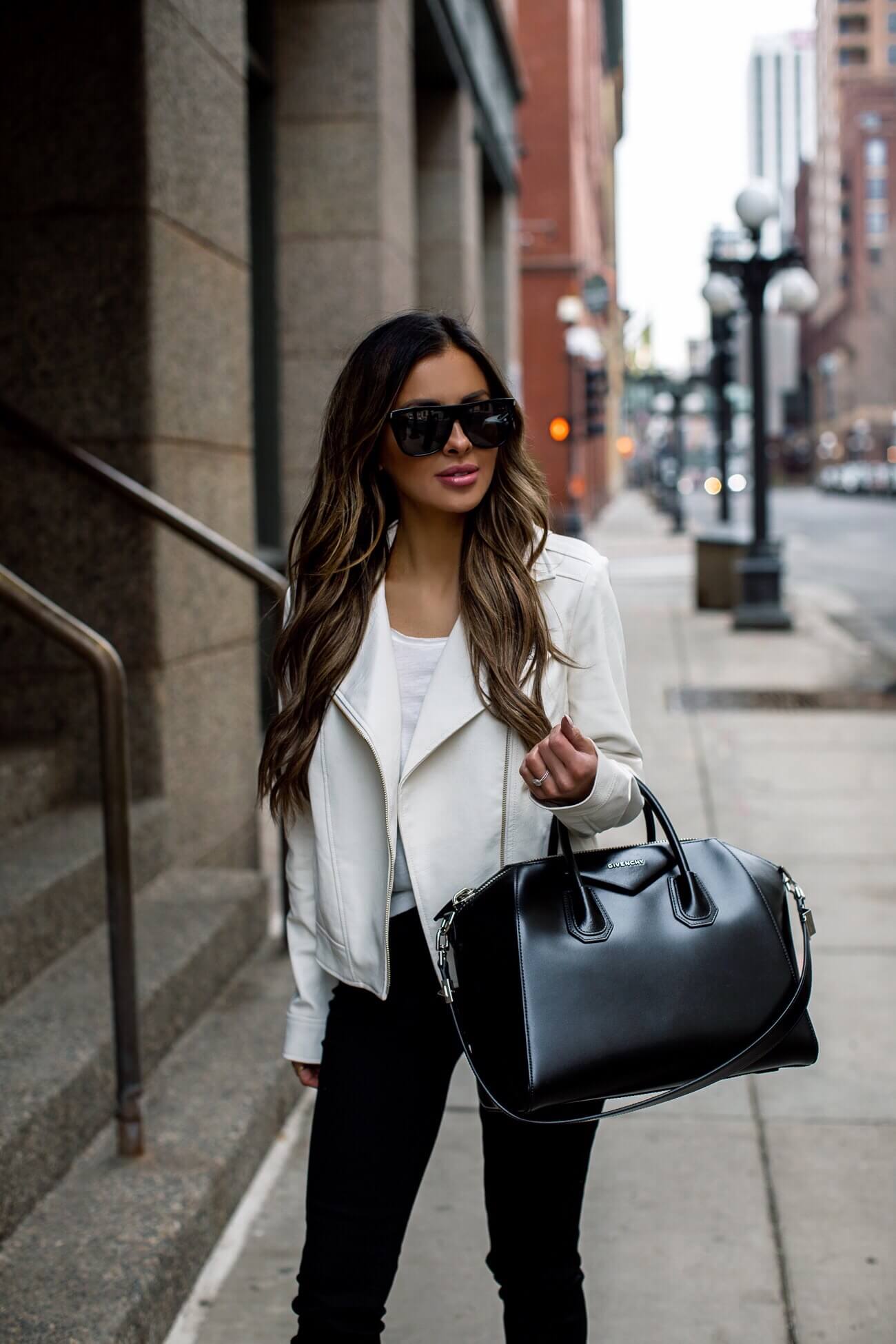fashion blogger mia mia mine wearing a white faux leather jacket from walmart