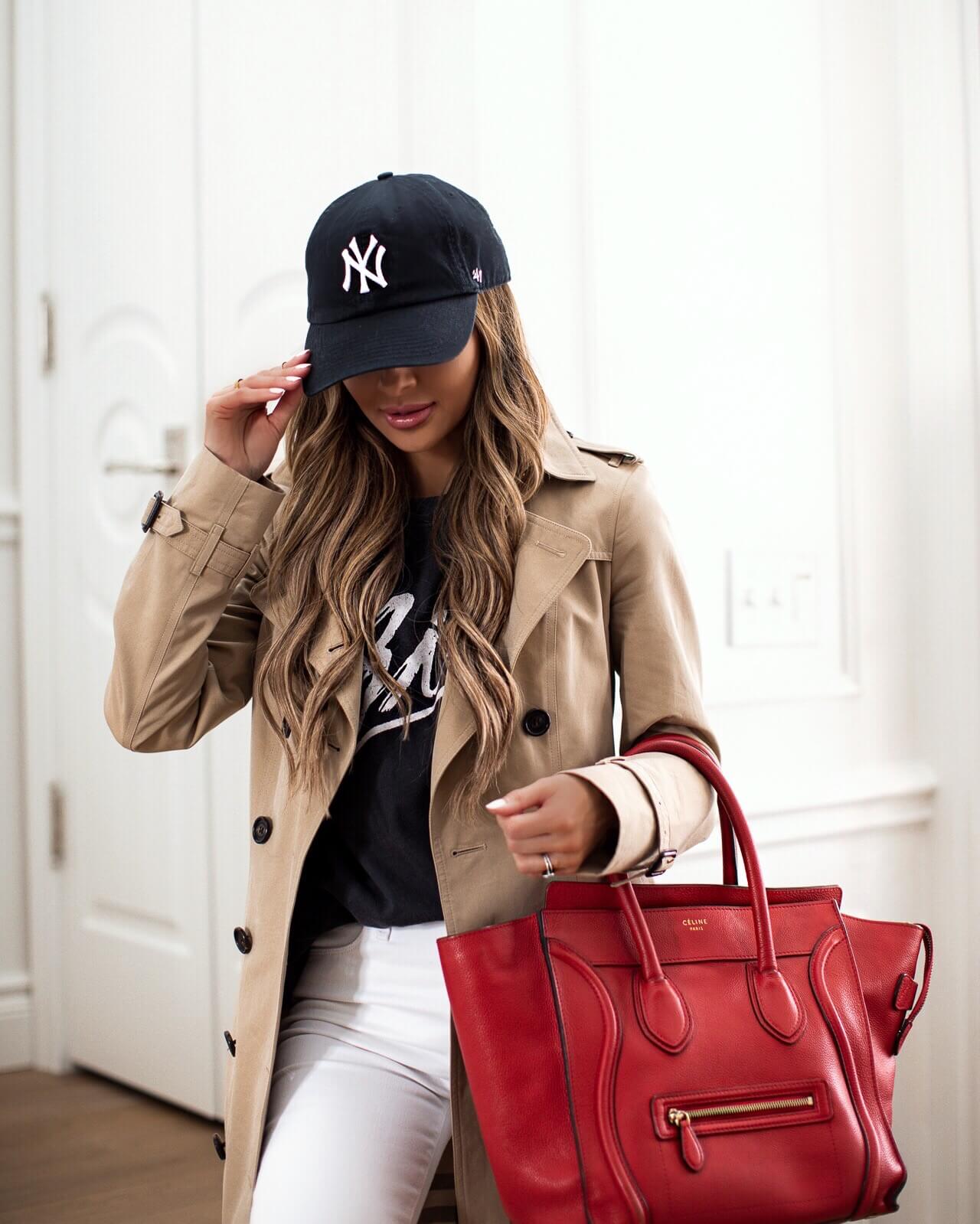 fashion blogger mia mia mine wearing a burberry trench and a red celine bag