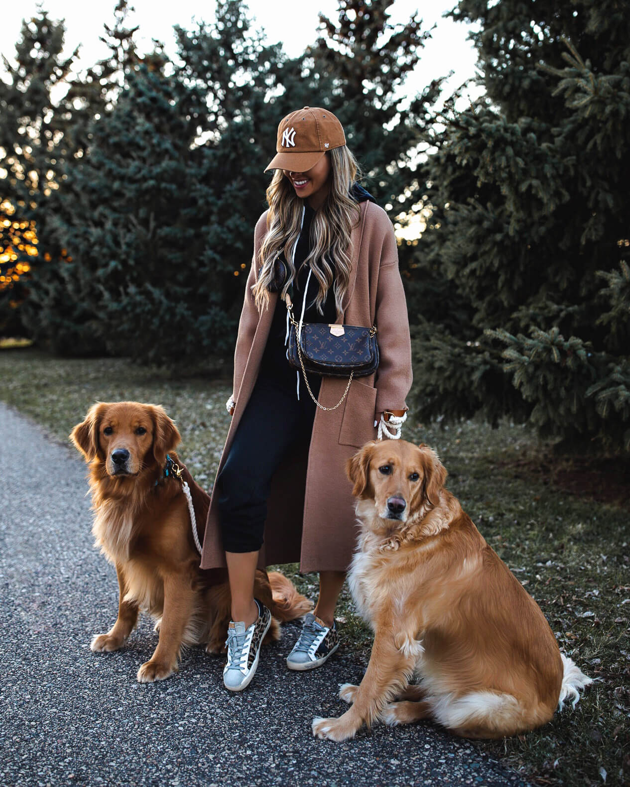 fashion blogger mia mia mine wearing a camel coat and a target sweatsuit