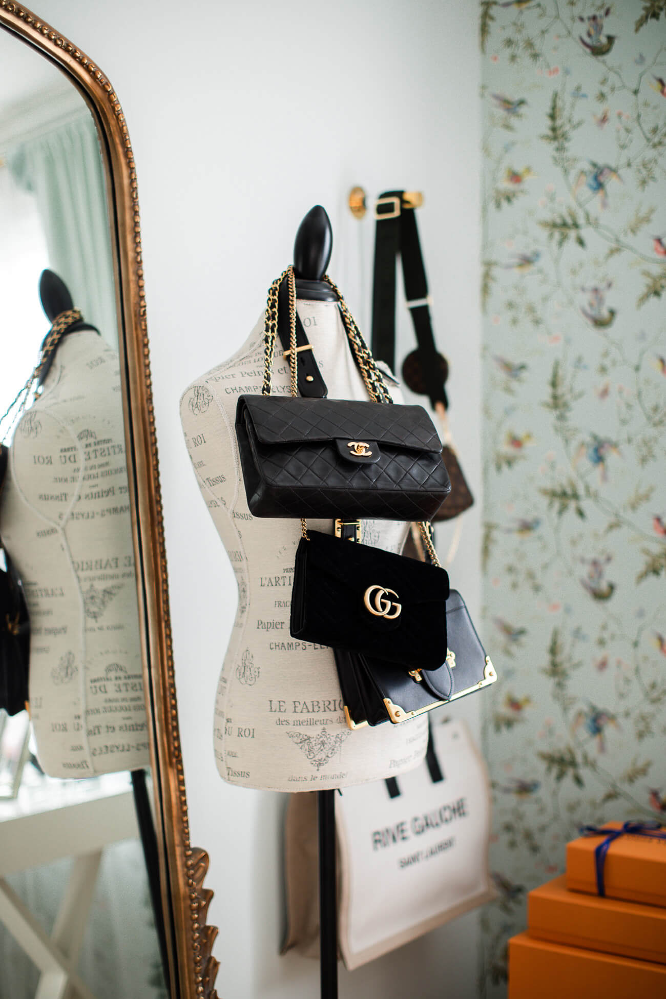 dress form displaying handbags fashion blogger home office