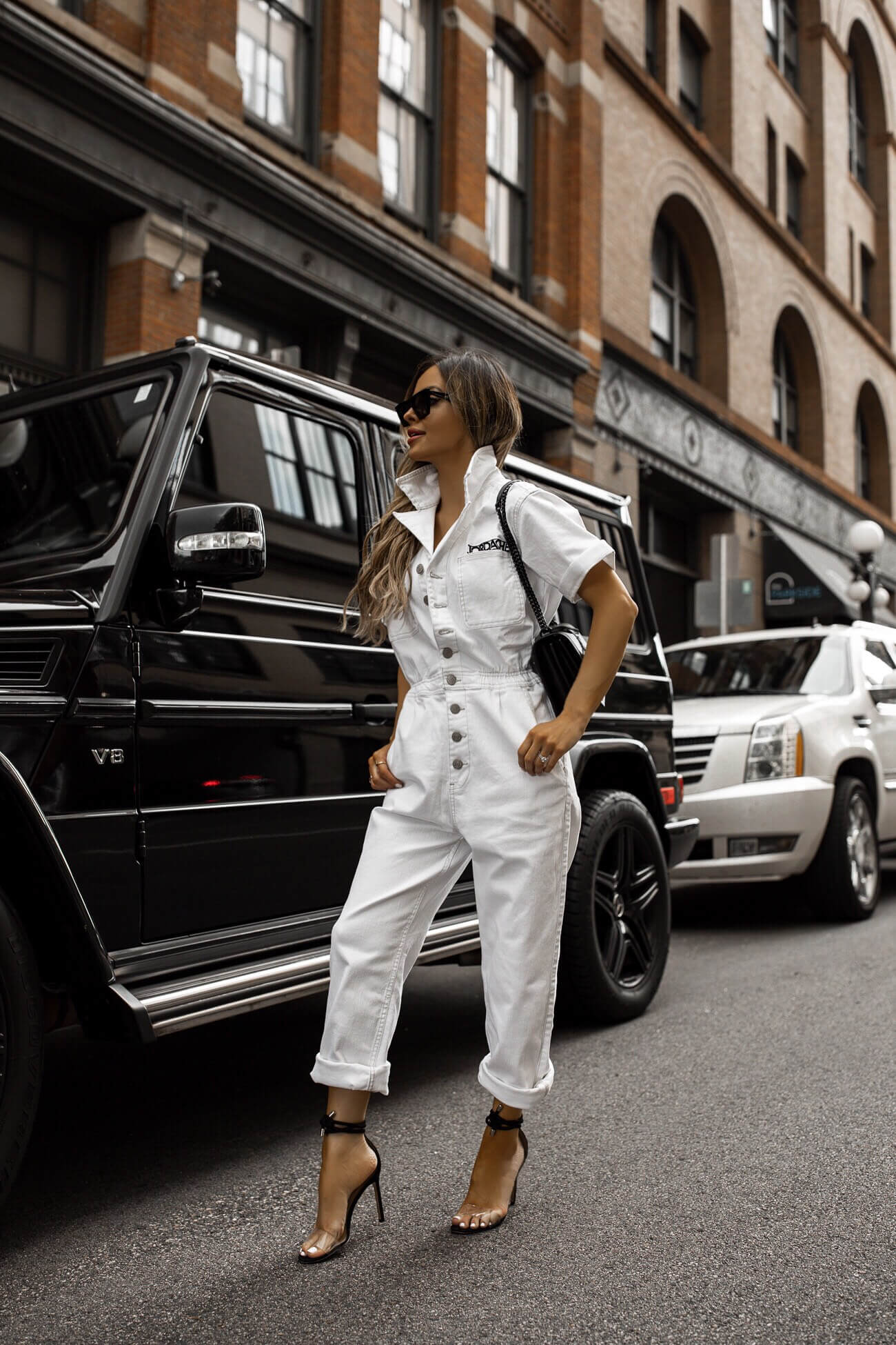 fashion blogger mia mia mine wearing a white jumpsuit from walmart