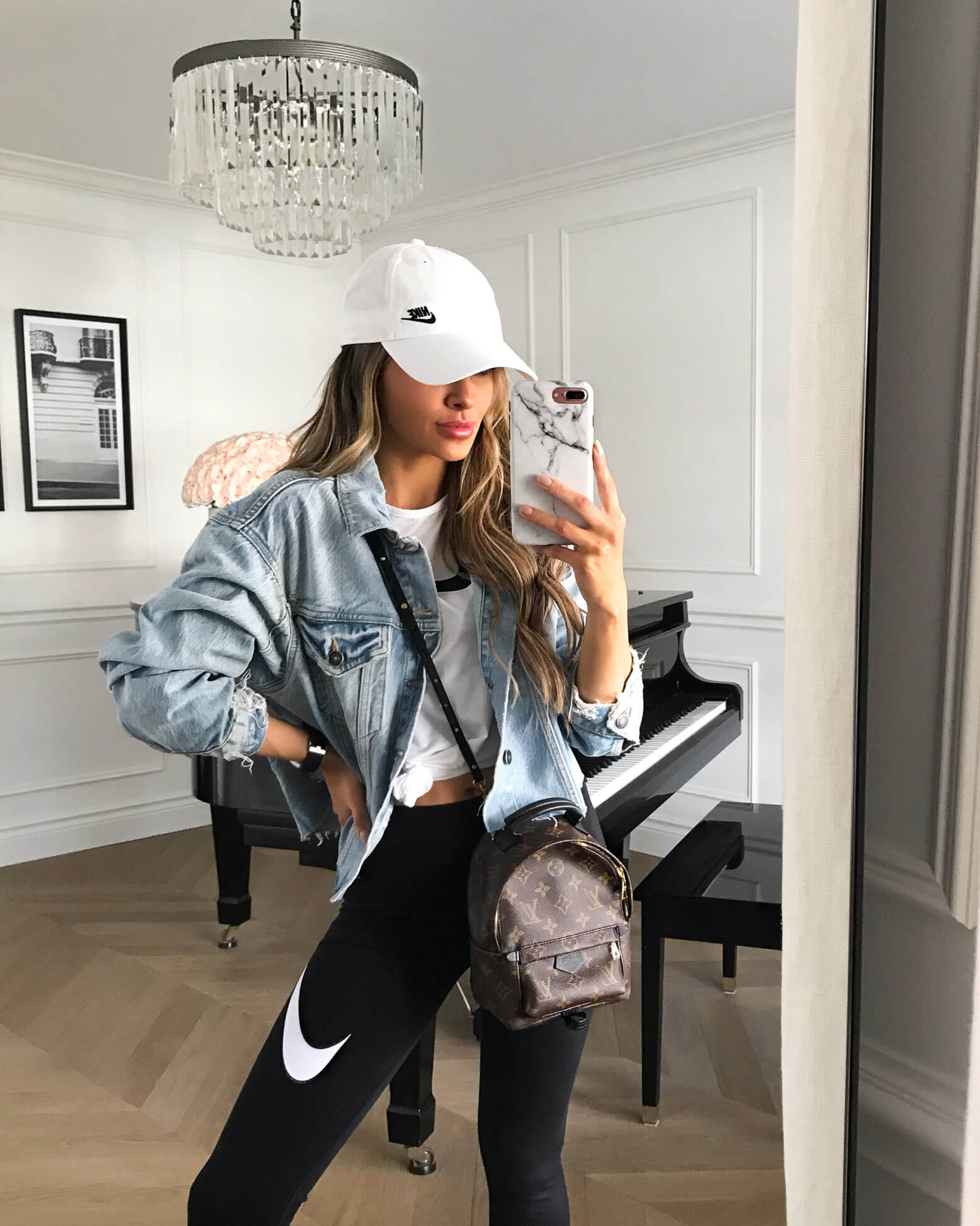 fashion blogger mia mia mine wearing a nike outfit at home