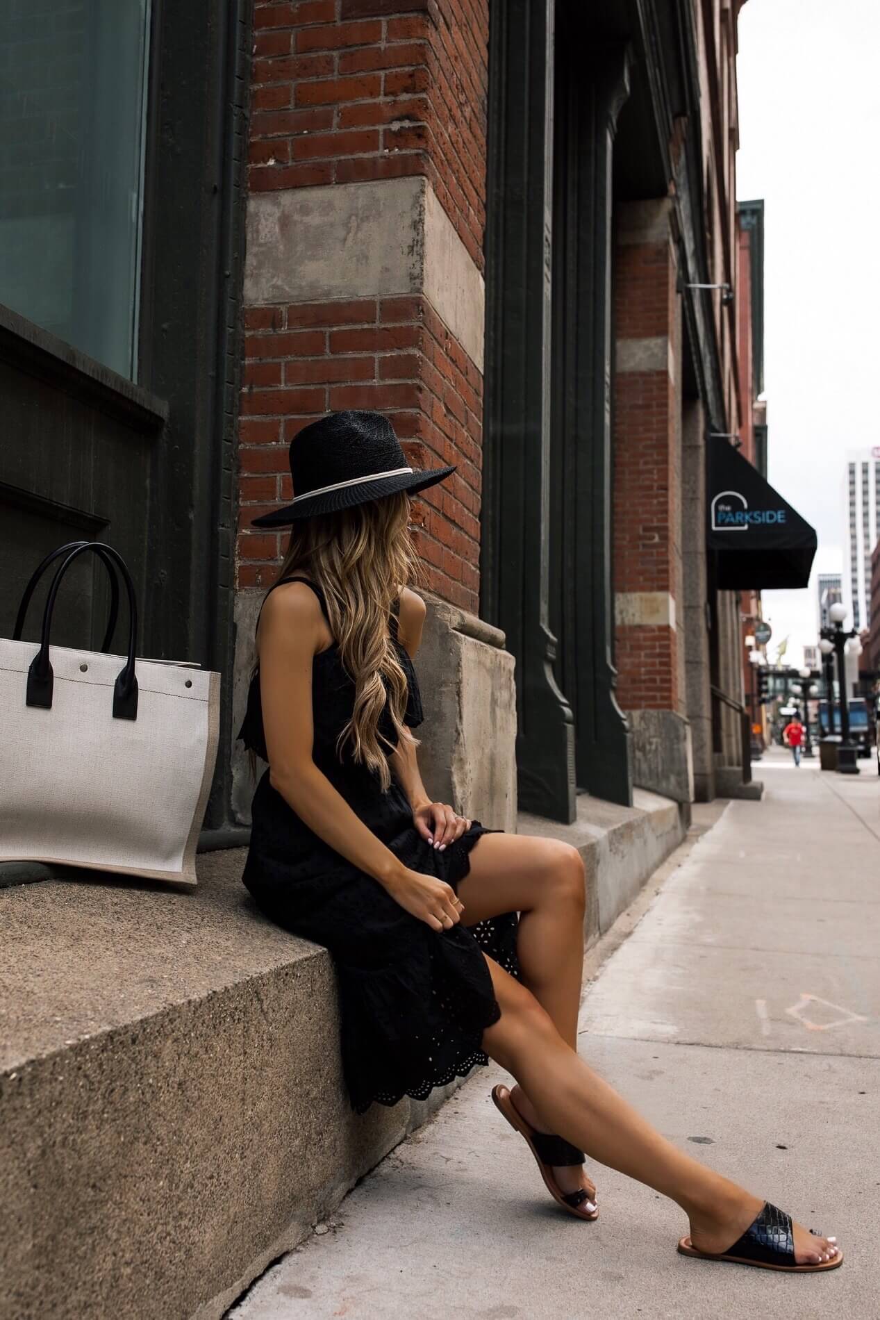 fashion blogger mia mia mine wearing a casual black lace dress for summer