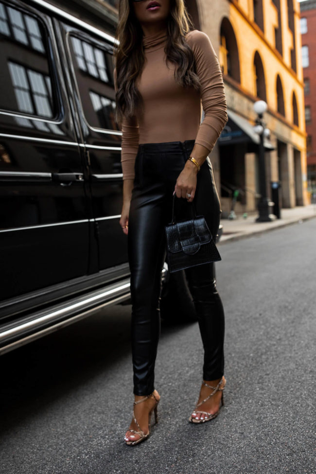 fashion blogger mia mia mine wearing faux leather pants from walmart
