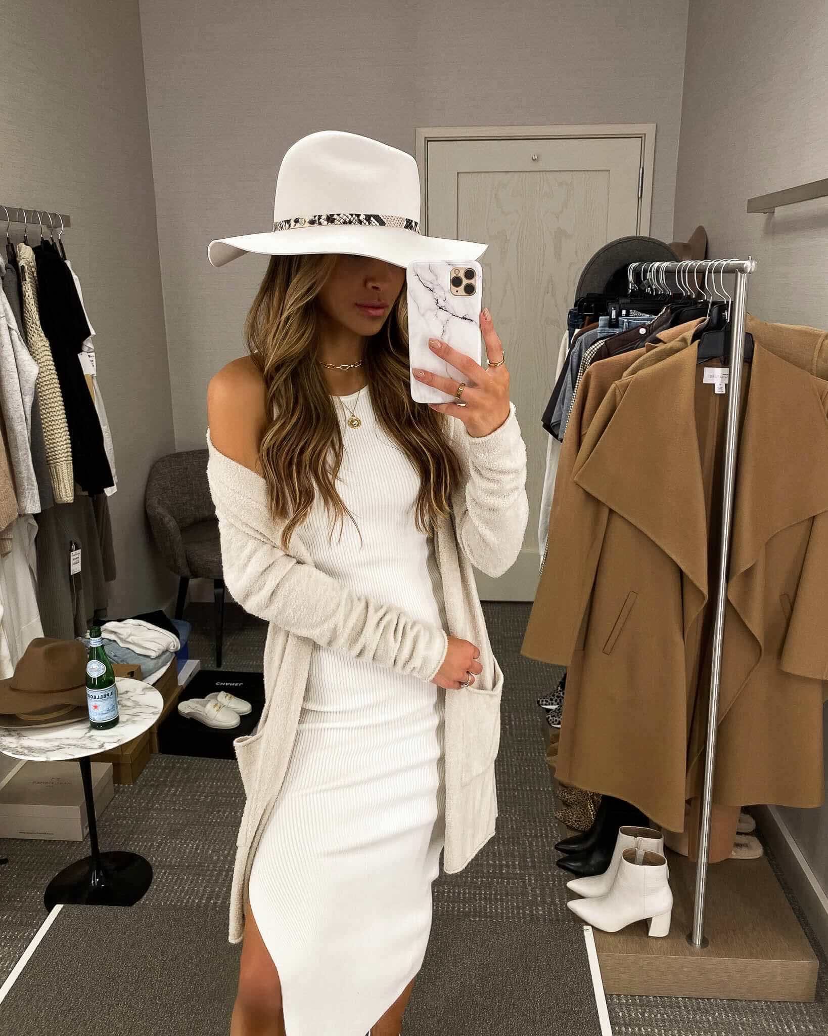 fashion blogger mia mia mine wearing a white dress with a white hat from the nordstrom anniversary sale