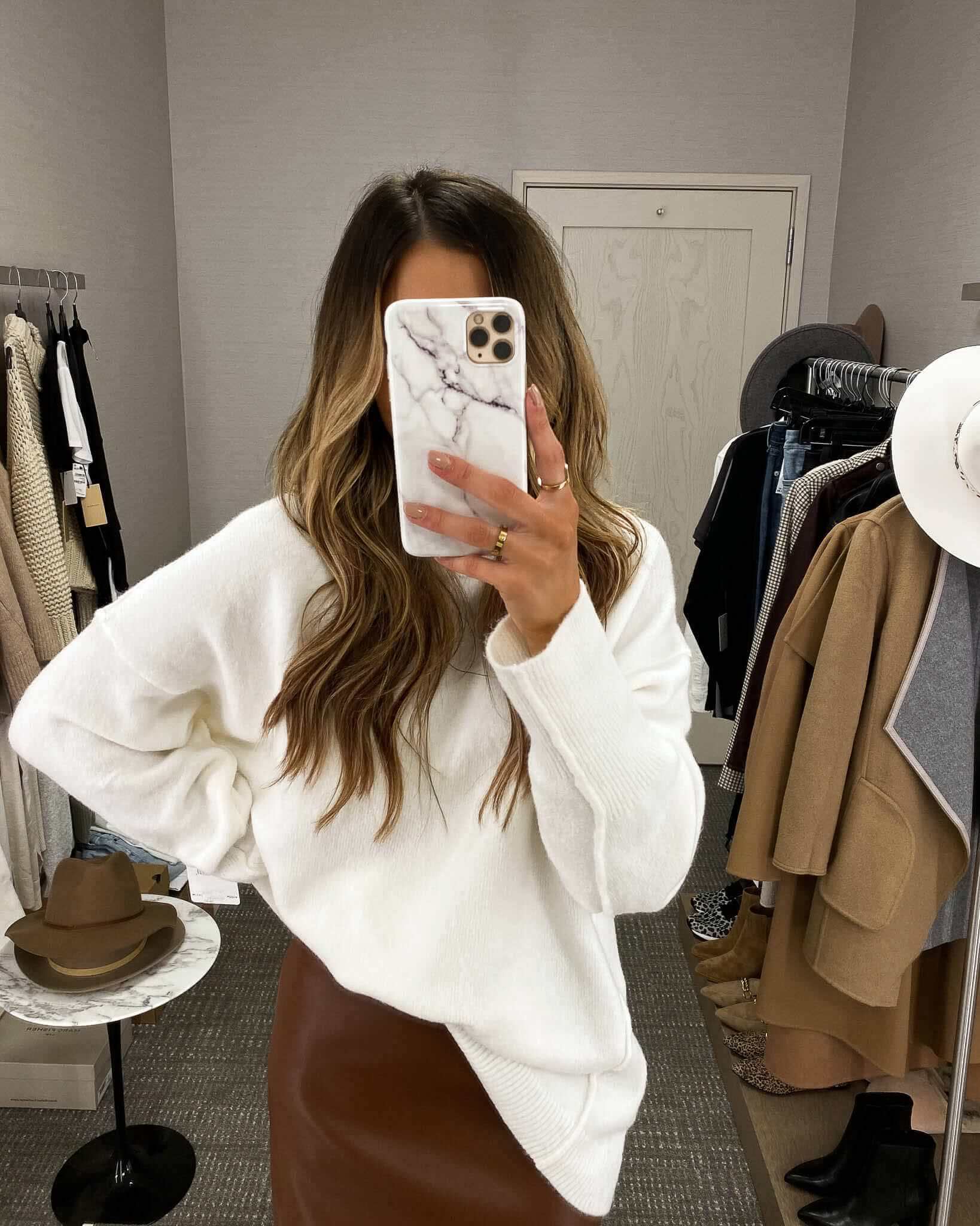 fashion blogger mia mia mine wearing a white free people sweater from the nsale
