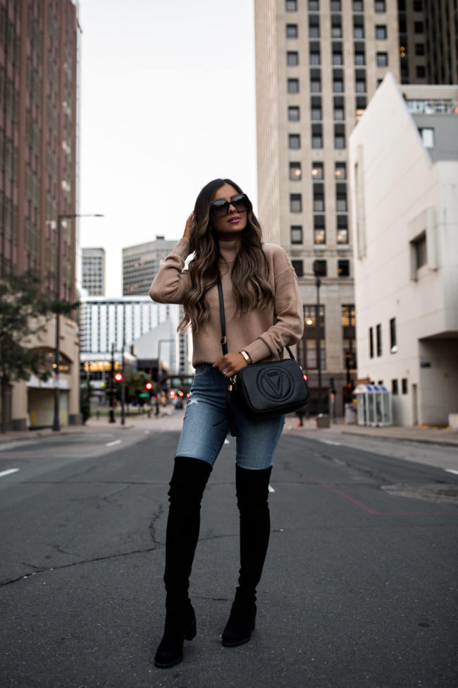 fashion blogger wearing black over the knee boots for fall