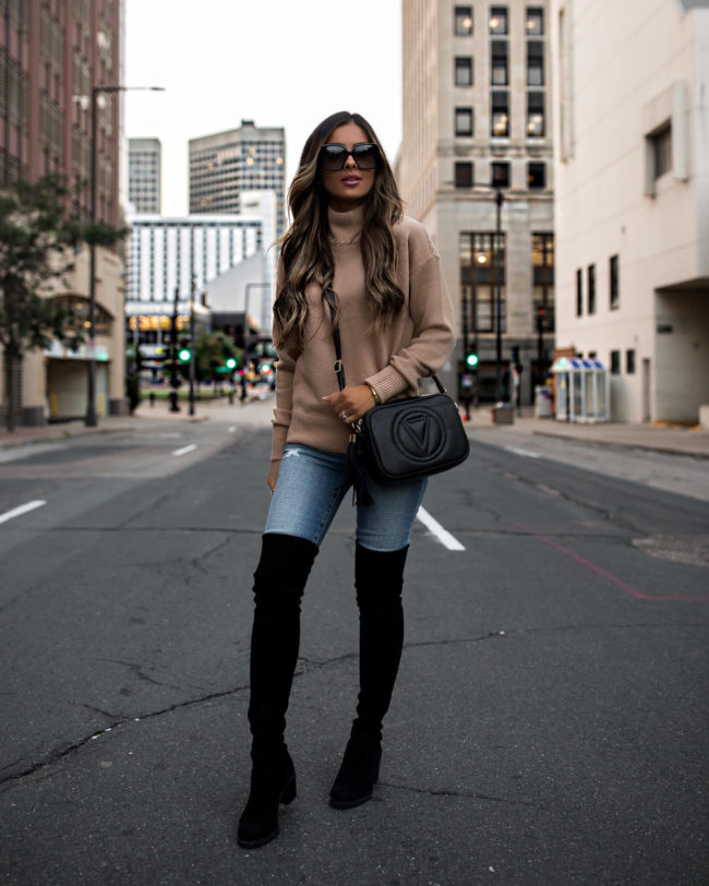 fashion blogger mia mia mine wearing a camel sweater and denim from saks off 5th for fall