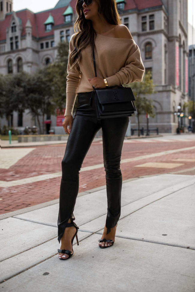fashion blogger mia mia mine wearing leather pants and a camel sweater from intermix