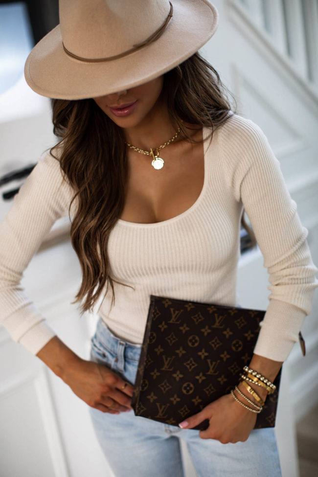 fashion blogger mia mia mine wearing a gold necklace from the styled collection