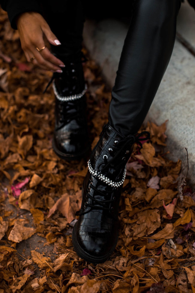 fashion blogger wearing black embellished combat boots for fall