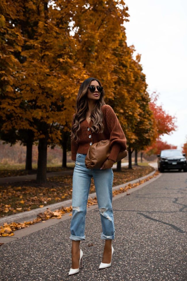 fashion blogger wearing an orange cardigan for fall from intermix