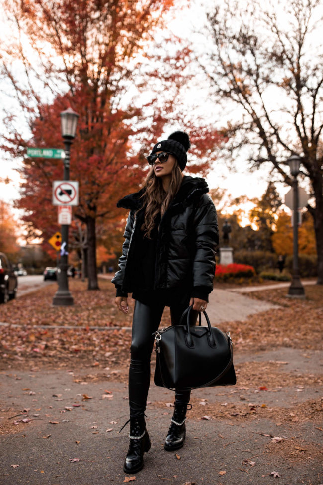 fashion blogger mia mia mine wearing black faux leather leggings from express