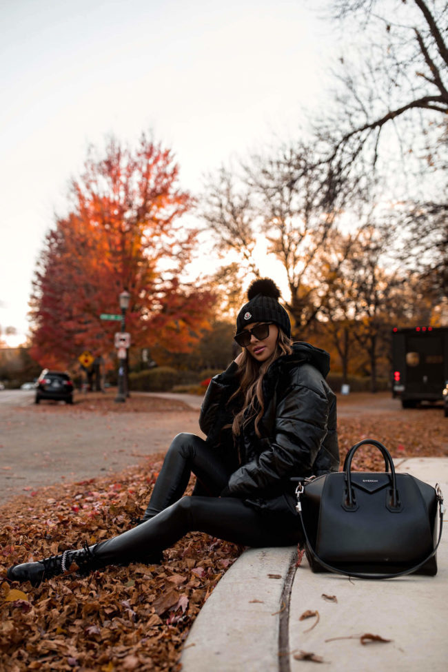 fashion blogger mia mia mine wearing an all black outfit from express