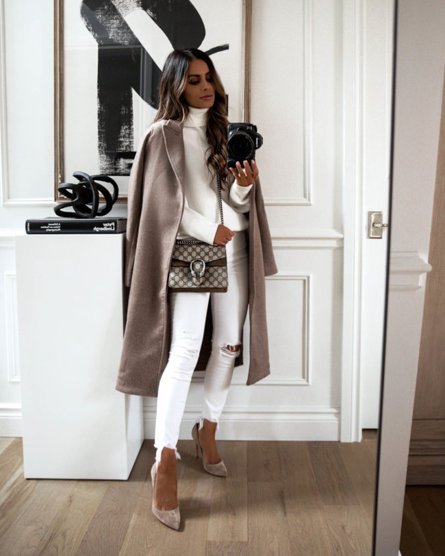 fashion blogger mia mia mine wearing a white outfit with a wool coat for fall