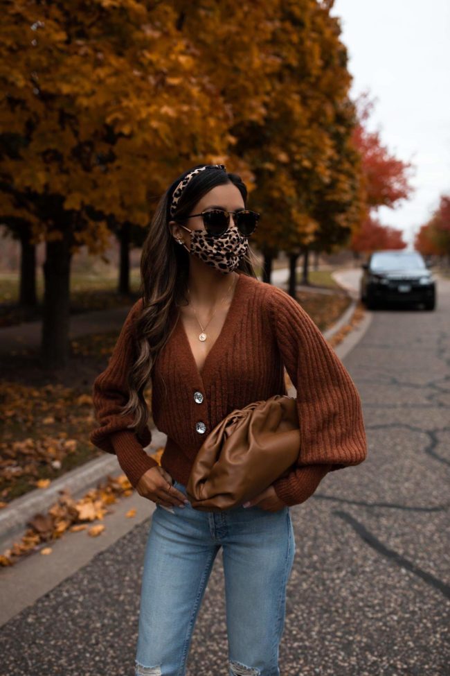 fashion blogger wearing a leopard print face mask from interix