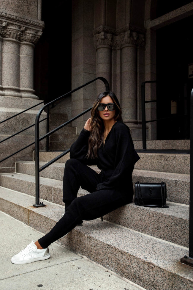mia mia mine wearing a black sweater set by sofia jeans