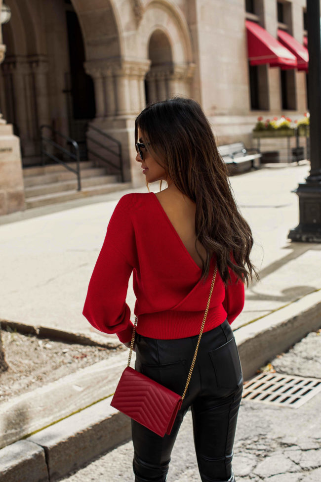 fashion blogger wearing a red sweater by sofia jeans holiday collection
