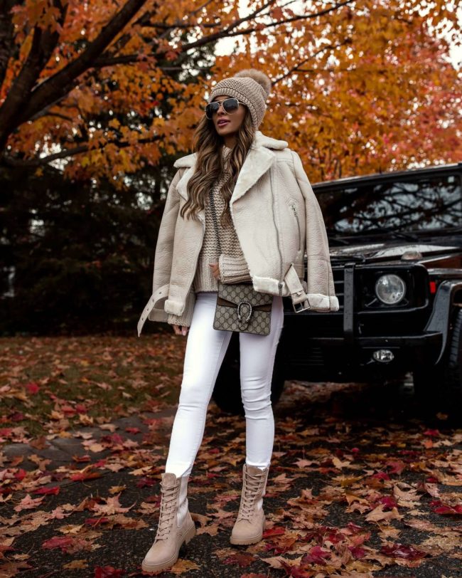 fashion blogger mia mia mine wearing a white biker jacket and beige combat boots from nordstrom