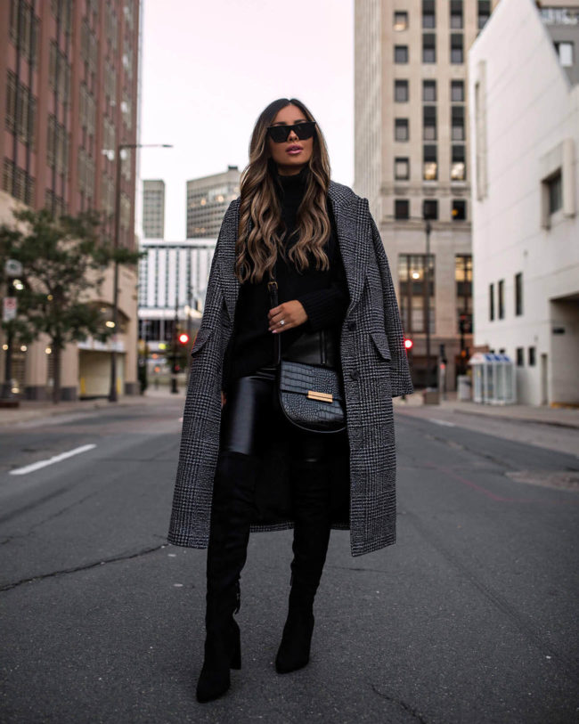 fashion blogger mia mia mine wearing a plaid coat and black leather leggings from walmart