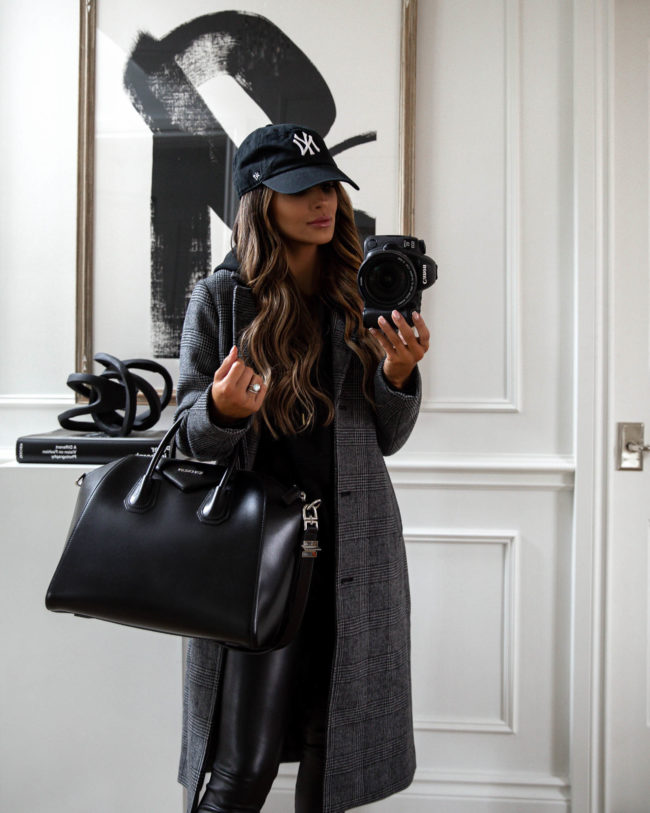 fashion blogger mia mia mine wearing a plaid coat and givenchy bag for fall