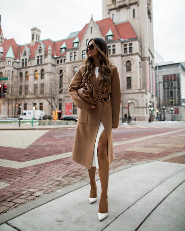 fashion blogger mia mia mine wearing a camel coat and bottega veneta bag
