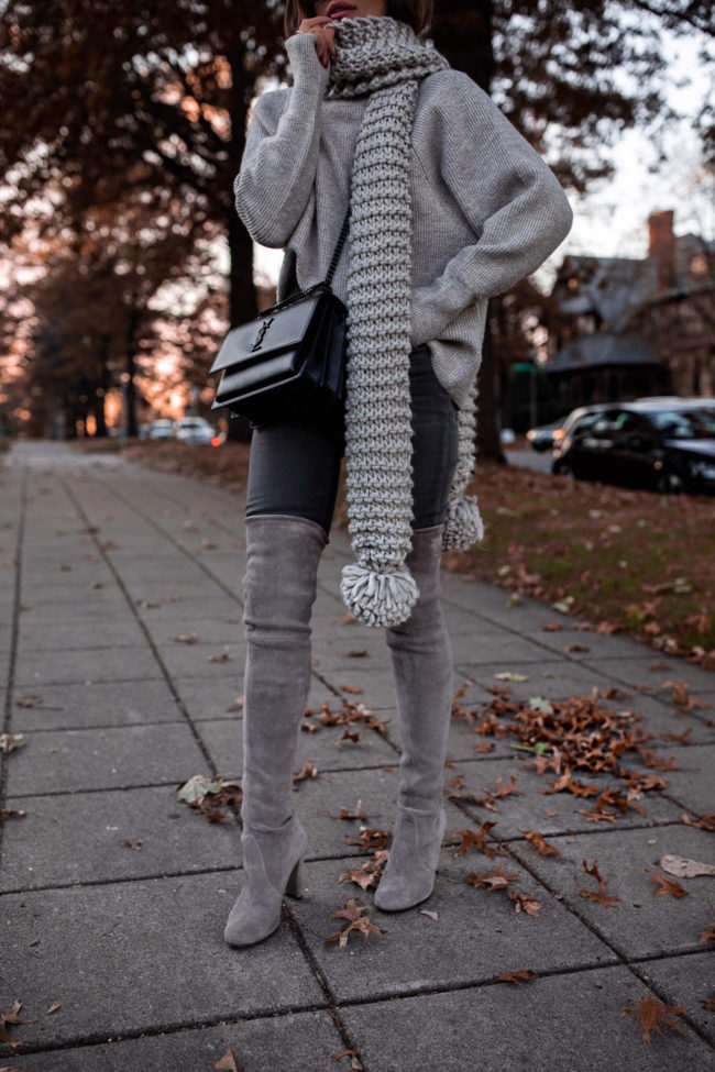 fashion blogger mia mia mine wearing a gray sweater and gray denim from express