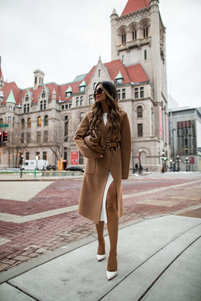 fashion blogger mia mia mine wearing a camel coat and bottega veneta bag