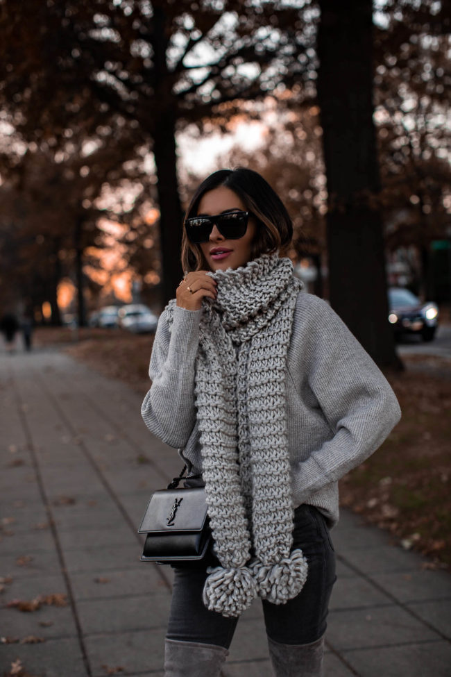fashion blogger wearing a chunky knit scarf from express