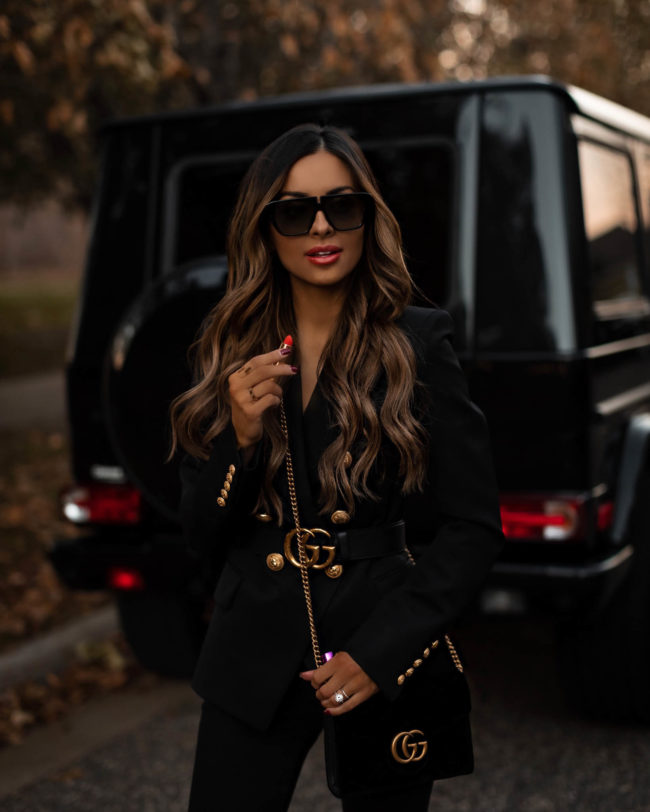 fashion blogger mia mia mine wearing a gucci belt and gucci lipstick