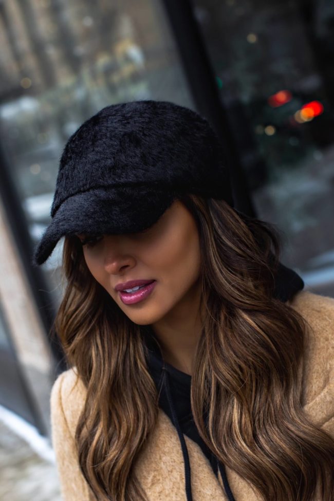 fashion blogger mia mia mine wearing a faux fur baseball hat from nordstrom