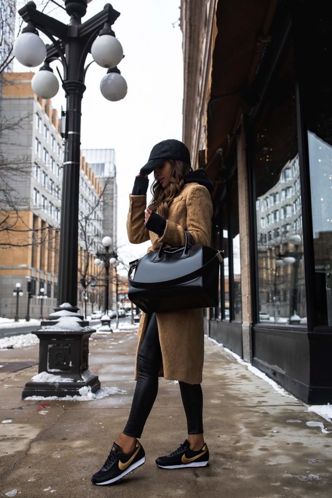 fashion blogger mia mia mine wearing a camel coat and nike daybreak sneakers from nordstrom