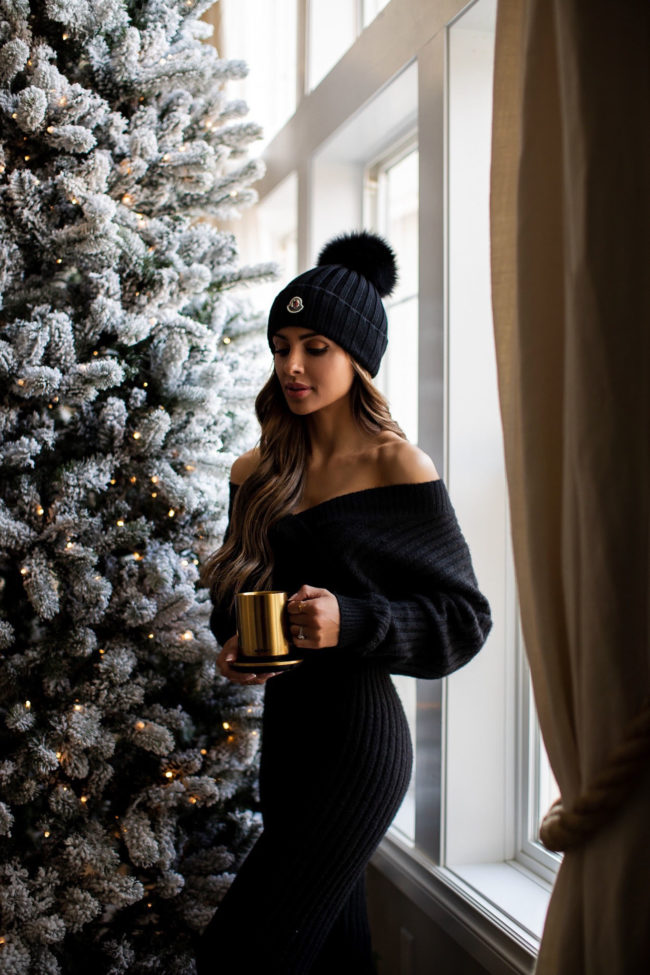 fashion blogger mia mia mine wearing a black knit set from bloomingdales