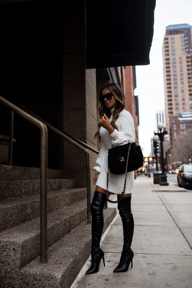 fashion blogger mia mia mine wearing a white tunic sweater with over the knee boots from forever21