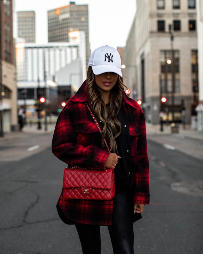 fashion blogger mia mia mine wearing a plaid shirt jacket from mango and red chanel bag