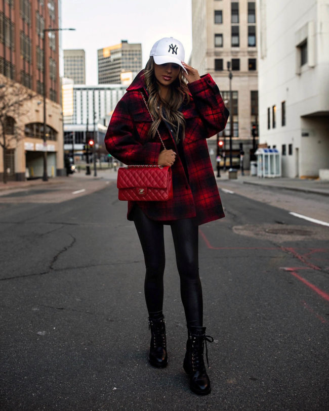 fashion blogger mia mia mine wearing a plaid shirt jacket from mango with faux leather leggings and combat boots