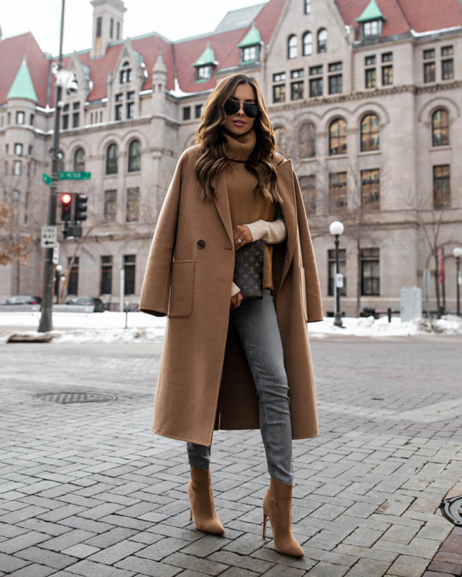 fashion blogger mia mia mine wearing a camel coat and gray denim from revolve