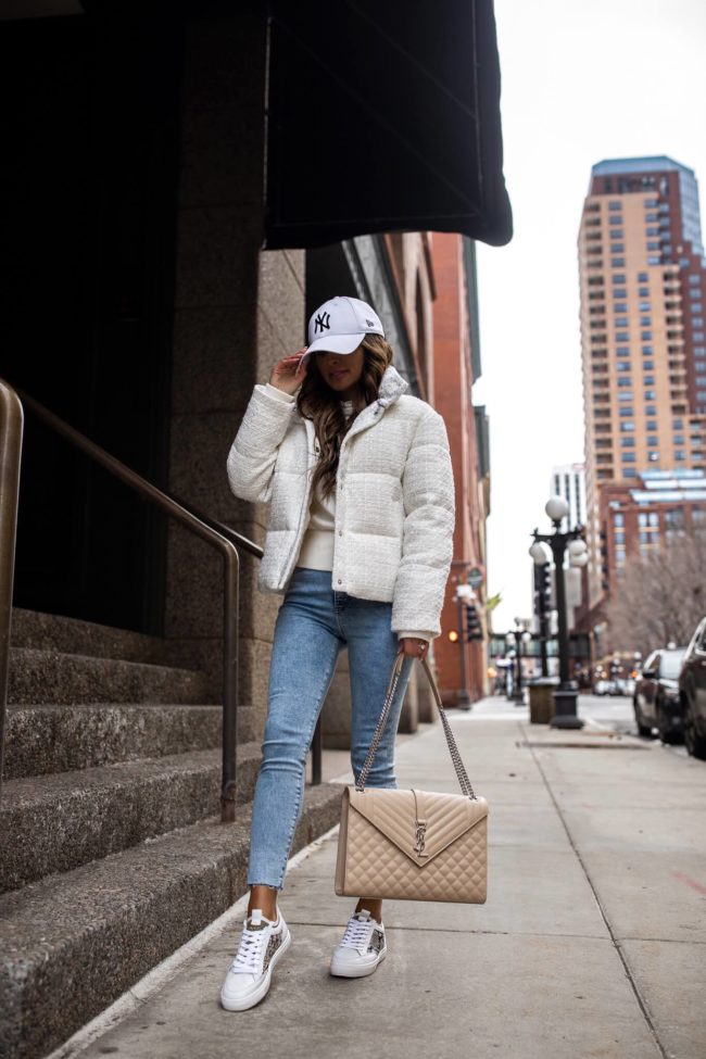 fashion blogger mia mia mine wearing a white boucle puffer jacket for winter