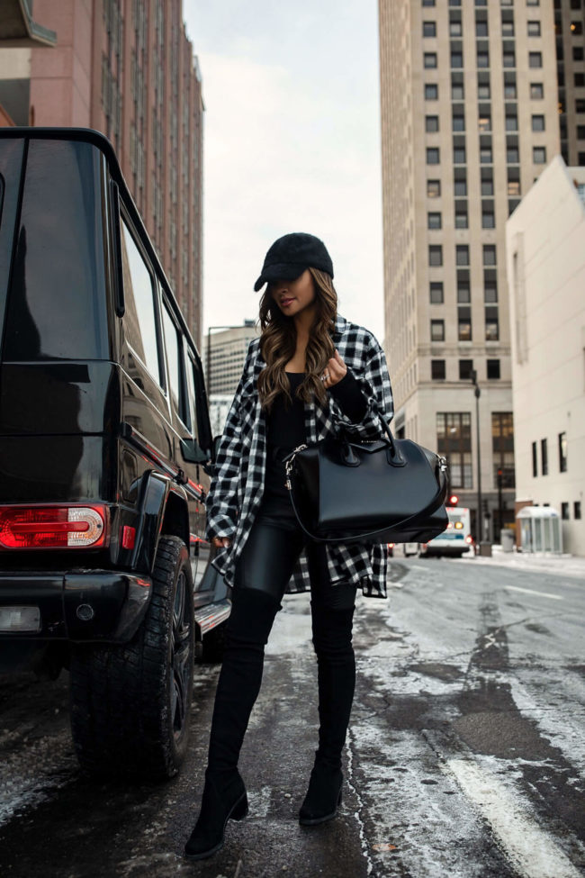 fashion blogger mia mia mine wearing a black and white plaid shirt and faux leather pants from nordstrom