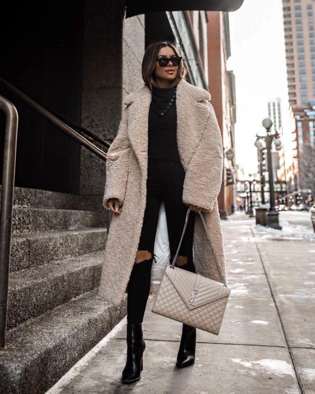 fashion blogger mia mia mine wearing a teddy bear coat from revolve